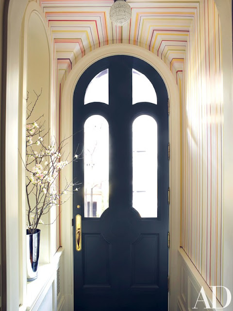 Cheerful colorful stripes in a chic New York townhouse entry - found on Hello Lovely Studio