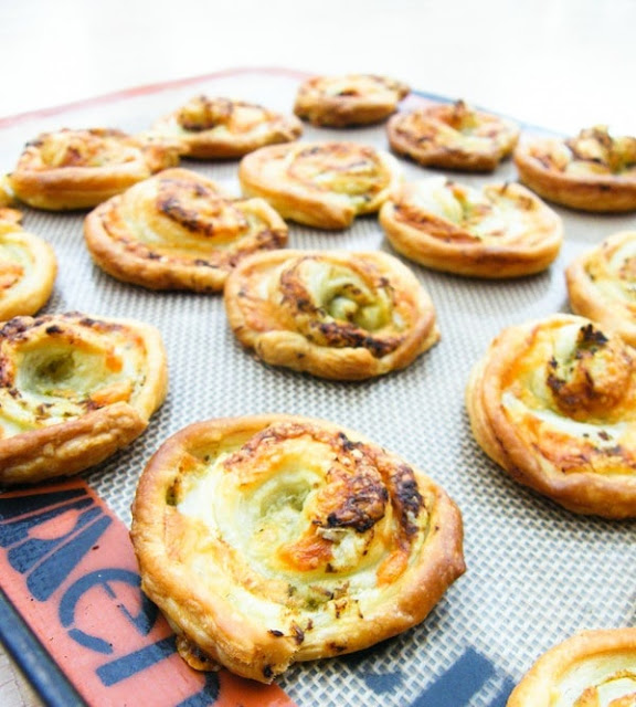 A tray of Vegan Pesto Cheese Swirls on a tray just out of the oven