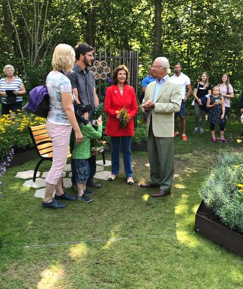 Queen Silvia wore a red long blazer for SilviaBo project at Ikea in Älmhult and visit the Themed Gardens exhibition at Solliden
