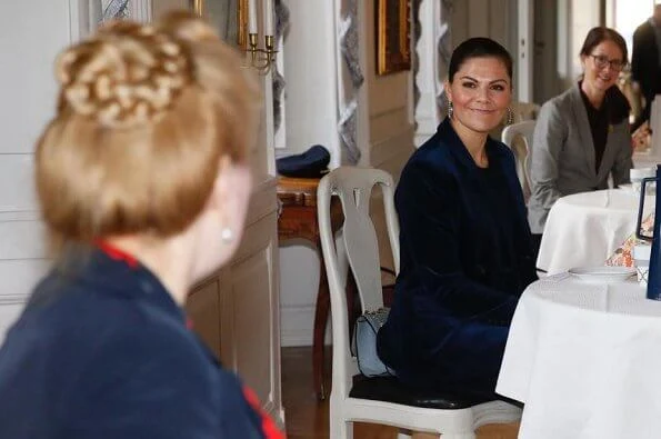 Princess Victoria wore a cord suit by Dagmar, and blue boots by af Klingberg, and pyramid earrings by Sophie by Sophie