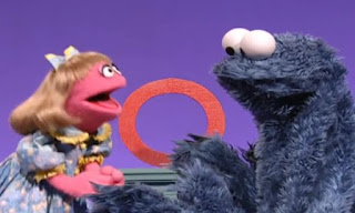 Prairie Dawn explains that is not a cookie. It is the letter of the day the letter O. Cookie Monster thinks it's a cookie. Sesame Street Episode 4070, Season 35