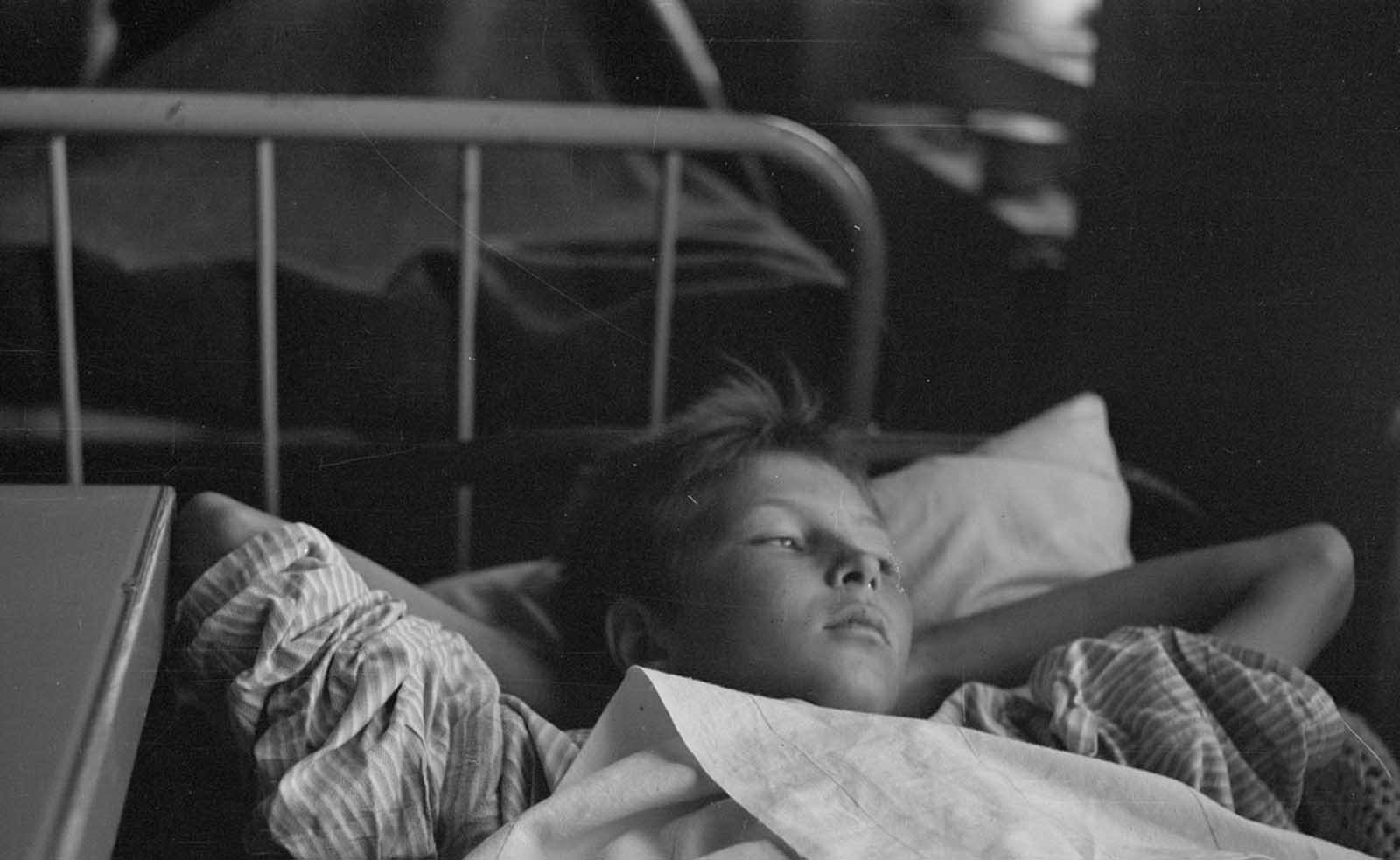 Thirteen-year-old Veikko Rantala lies wounded in Lieksanjoki Military hospital.