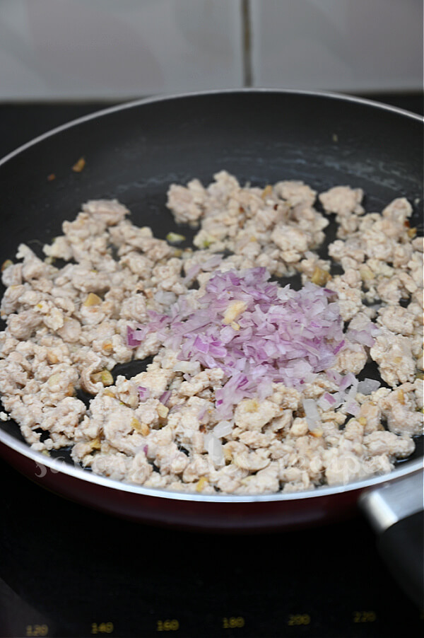 saute chicken and add onion to pan