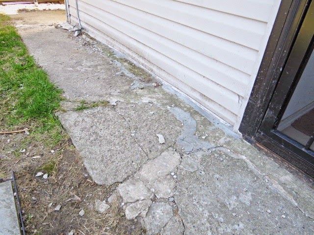 broken sidewalk at back door