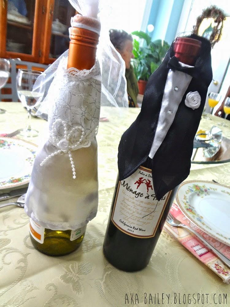 Wine bottles dressed as bride and groom