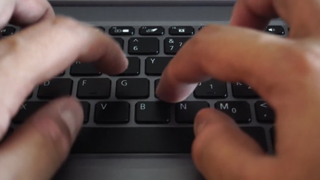 I am typing on the keyboard to check for the tactile feedback and its consistency.
