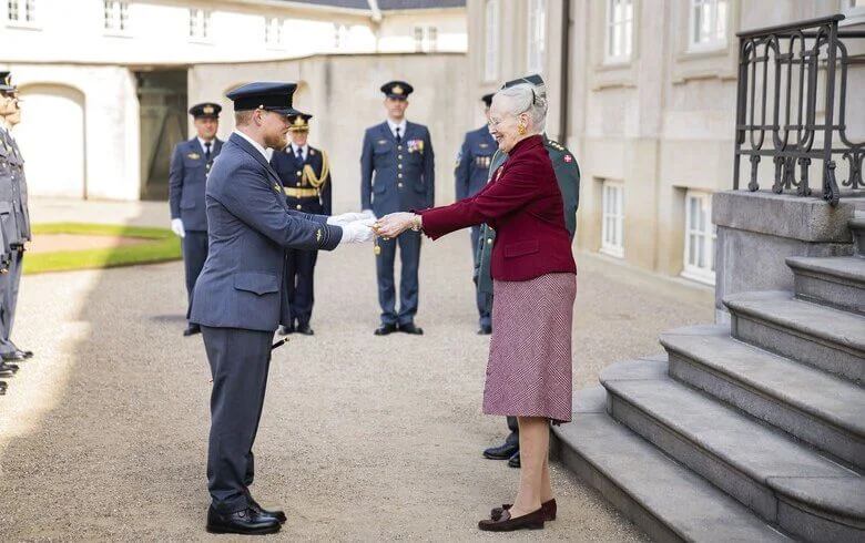 During the three receptions in the garden, Queen Margrethe of Denmark wore a red jacket and beige dress