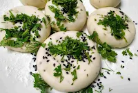 Dough balls topped with coriander leaves and Nigella seeds for kulcha recipe