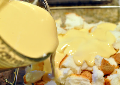 pour pudding mixture on the torn up angel food cake