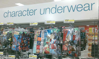 Store display of packaged underwear with large sign above that reads Character Underwear