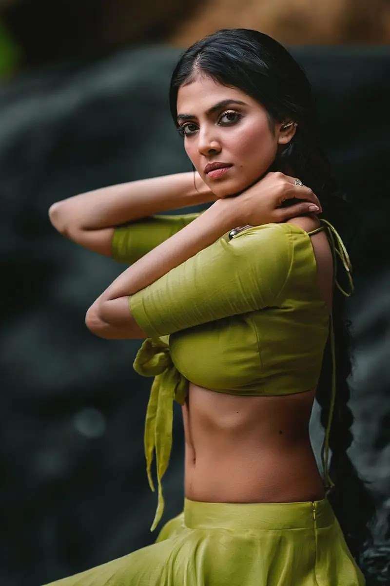 Actress Malavika Mohanan Latest Photos In Green Skirt And Knotted Blouse Actress Malavika Mohanan Latest Photos In Green Skirt And Knotted Blouse