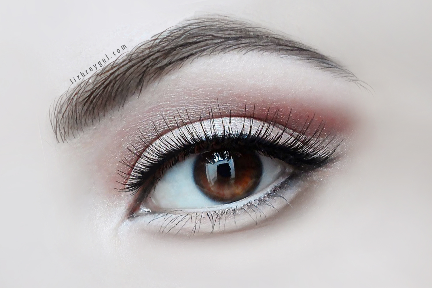 a close-up of a woman's eye with a tear bag kawaii eye makeup look and false lashes