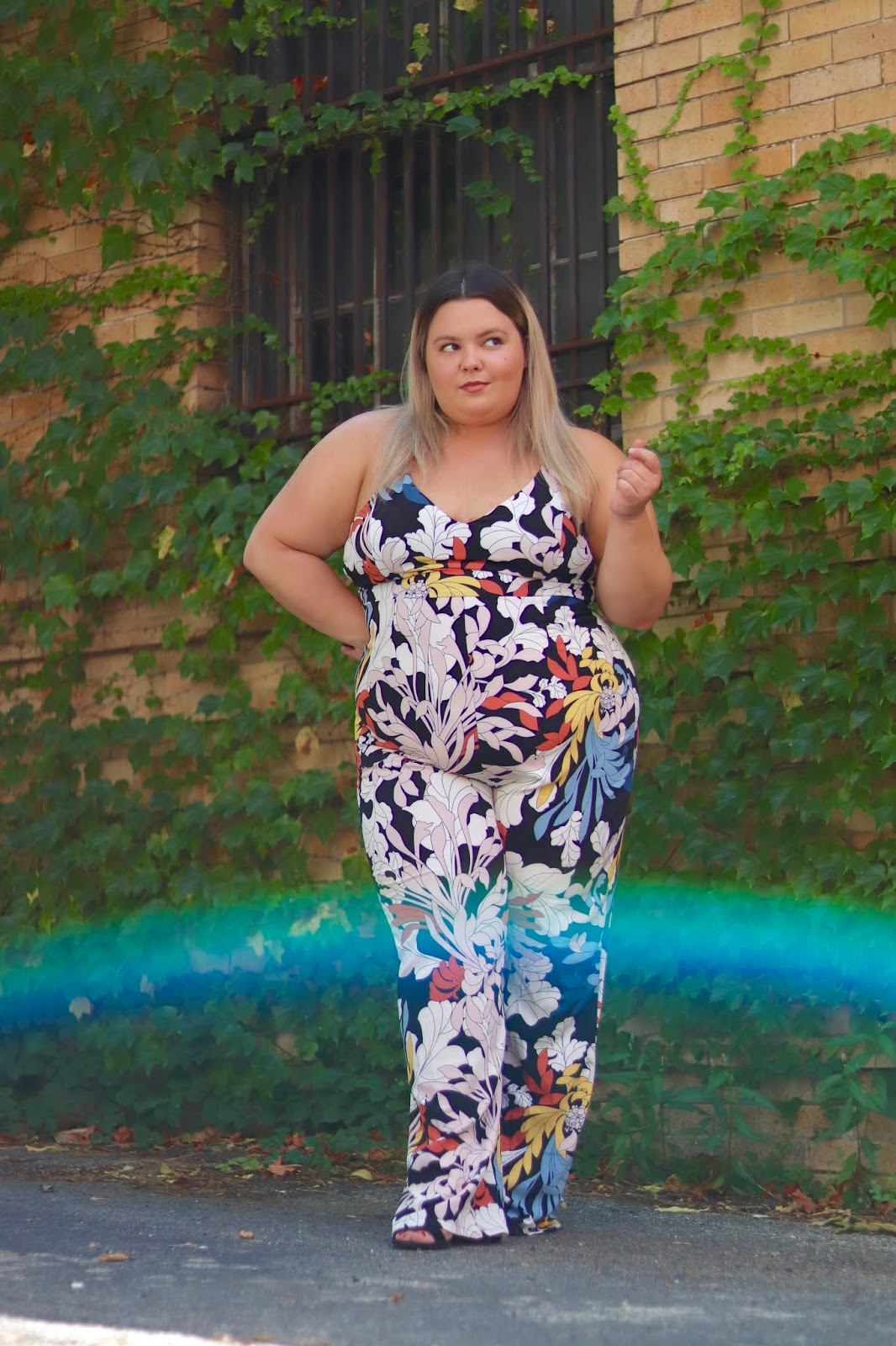 Chicago Plus Size Petite Fashion Blogger, influencer, YouTuber, and model Natalie Craig, of Natalie in the City, review's Fashion Nova's floral jumpsuits.