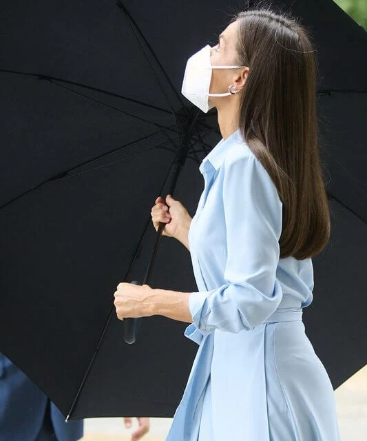 Queen Letizia wore a light blue belted shirt dress from 2019 collection of Pedro del Hierro. Carolina Herrera pumps