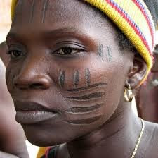 Logs and Rails Quilt Design on a west African Girls Face.