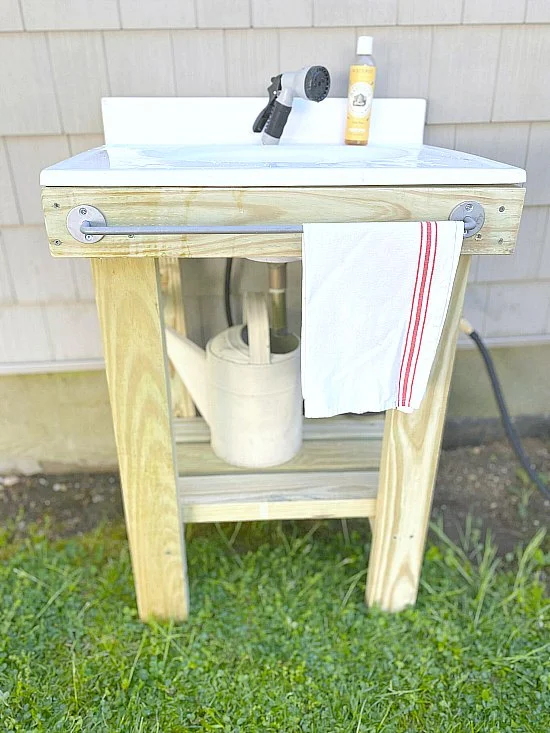 Outdoor sink with towel rack and grain sack towel