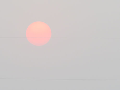 red sun in fog
