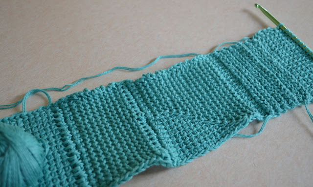Test swatch in green cotton showing different stitches and textures.