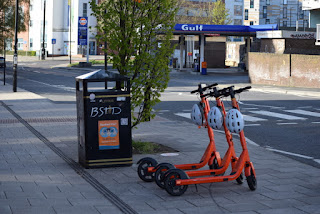 Bright orange e-scooters on Stoddart Street