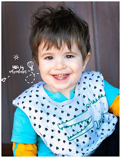Toddler Boy at Daycare wearing a bib