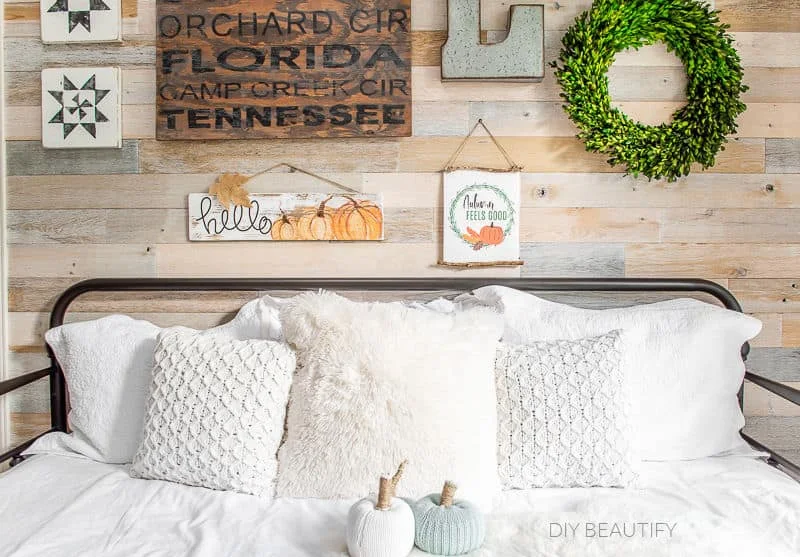 daybed with pillows and fall decor