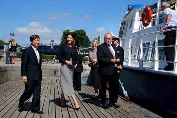Crown Prince Naruhito of Japan on a boat trip with Crown Princess Mary of Denmark. Princess wore Prada coat and Prada skirt