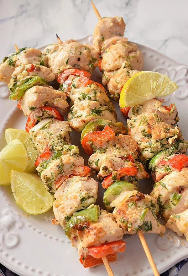 delicious moroccan chicken kabobs grilled to perfection served on a white plate