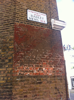 Ghost sign in Radley Mews, Kensington, London W8
