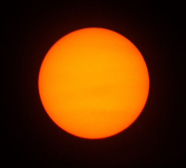 Nope, can't see the sunspots through the clouds, 300mm cropped, 1/500 second (Source: Palmia Observatory)