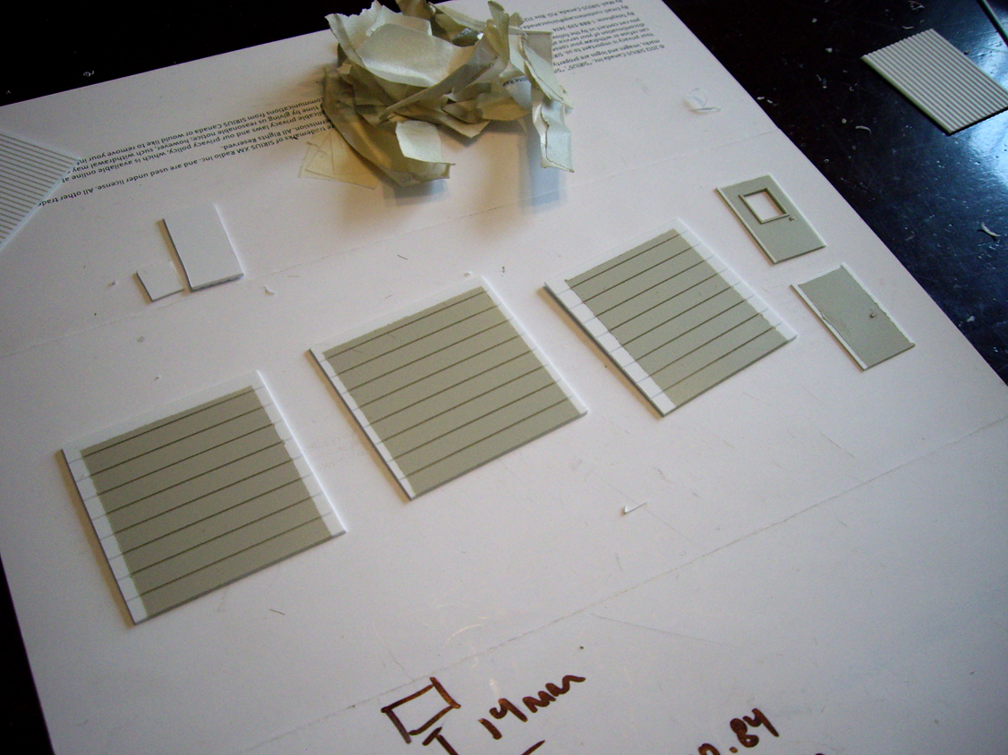 3 painted styrene overhead doors and 2 entry doors for a scratch built garage structure