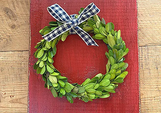 boxwood wreath with a gingham bow