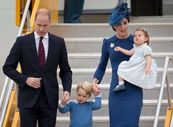 Duchess Catherine wore a bespoke blue dress by designer Jenny Packham. Gianvito Rossi 105 Suede Pumps. L.K. Bennett Nina Clutch.