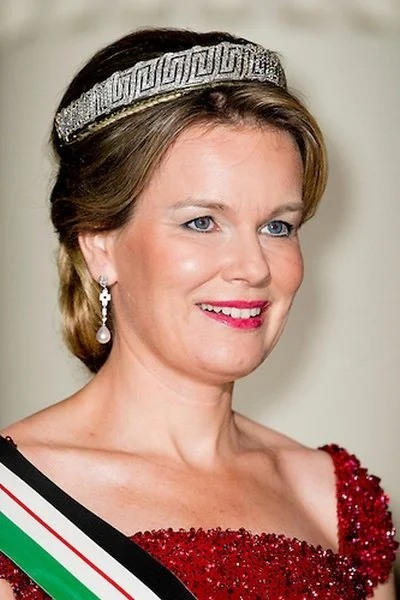 Queen Mathilde and Queen Rania attends a gala dinner at the Laeken royal Palace in Brussels. Queen Rania wore Valentino Gown, Queen Mathilde wore red gown. Queen Mathilde Tiara, Queen Rania diamond tiara