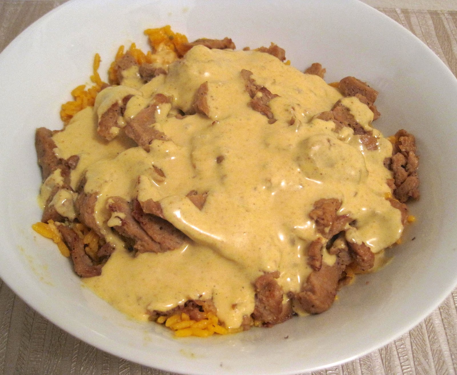 Vegocracy Dining In Curry Mustard Seitan With Yellow Rice