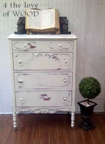 Antique dresser painted in black chalk paint, distressed and