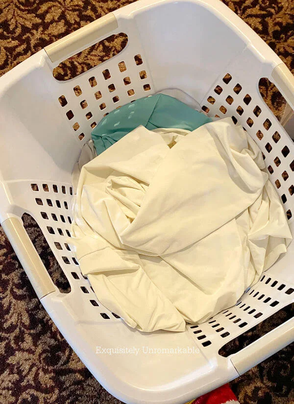 Laundry basket filled with curtains
