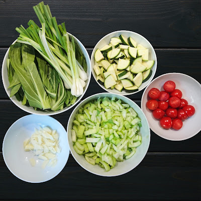 Picture of small cut vegetables in round bowls