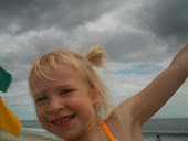 Kath at the beach, stormy day, but beautiful sunny smile.