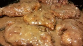 DEEP FRIED CHICKEN BREASTS AND SMOTHERED IN ONION GRAVY