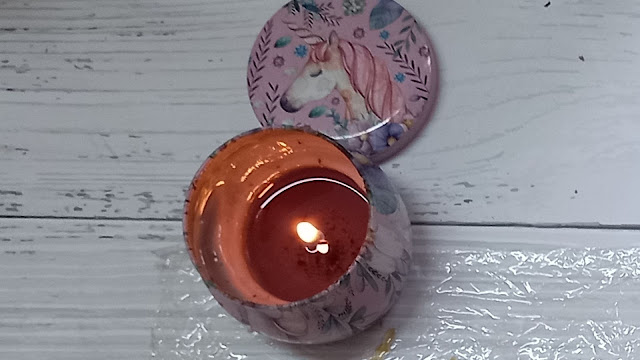Use a candle to burn the edges of the paper Use a candle to burn the edges of the paper