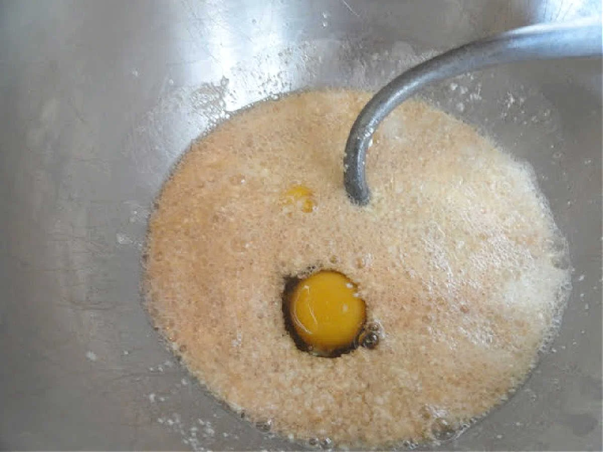 Egg, Buttermilk, Vanilla added to yeast mixture in a mixing bowl.