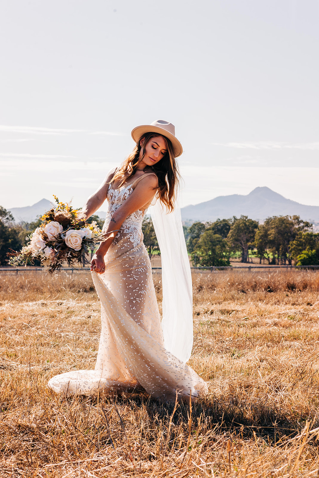 to the aisle australia | champagne at sunrise summer land camels shoot match made photography gold coast weddings country boho floral design cake stationery venue