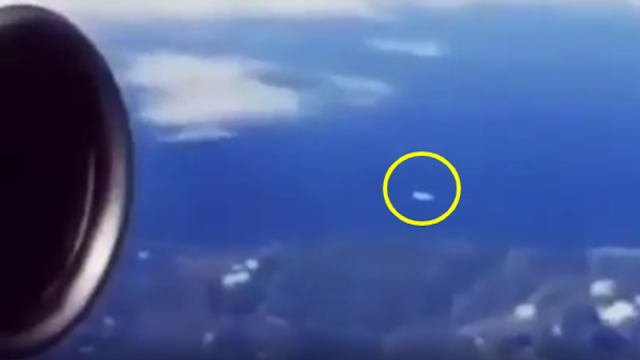 UFO passing a Jet in the sky filmed by a passenger.