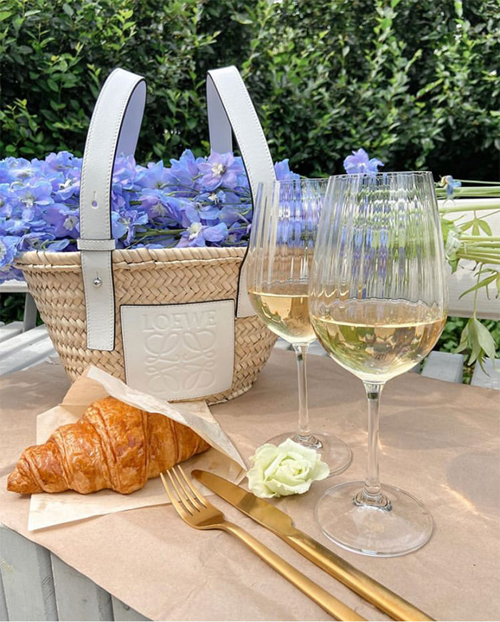 Style File | Mini Trend: Loewe’s Leather-Trimmed Woven Raffia Tote