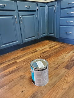 Picture of a paint can and kitchen cabinets