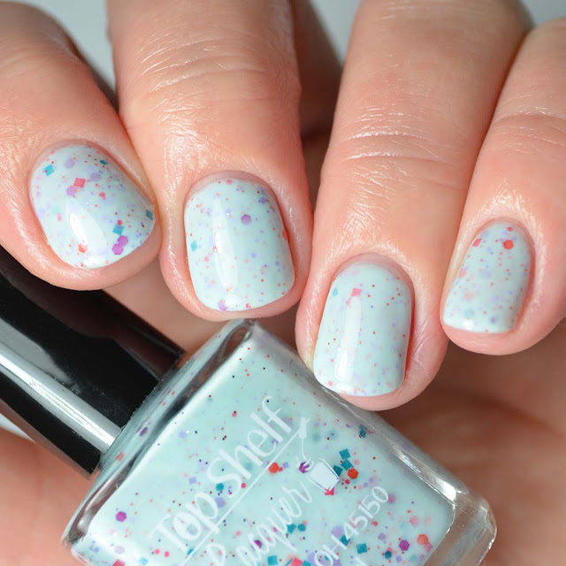 teal crelly nail polish with glitter swatch