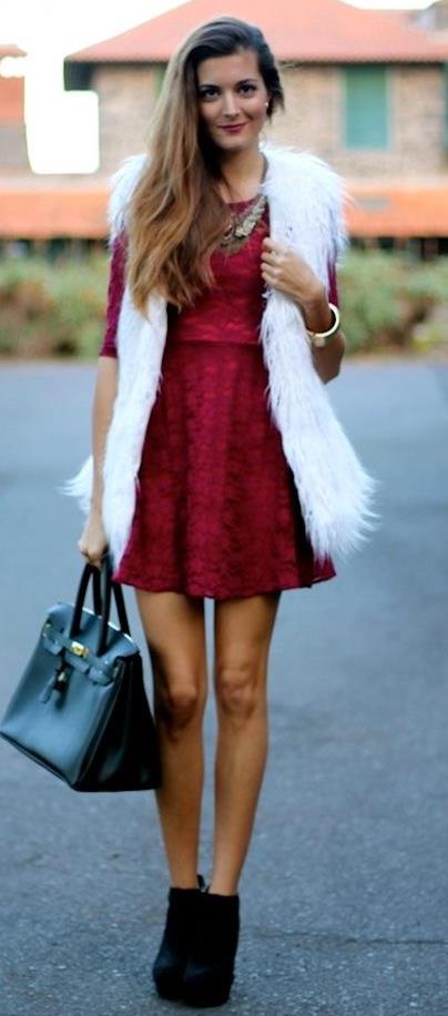 what to wear with a white fur vest : black bag + boots + red dress