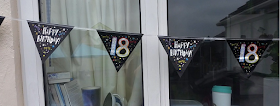 18th birthday banners up at the window
