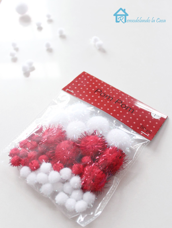 A packgage of 50 red and white pom poms