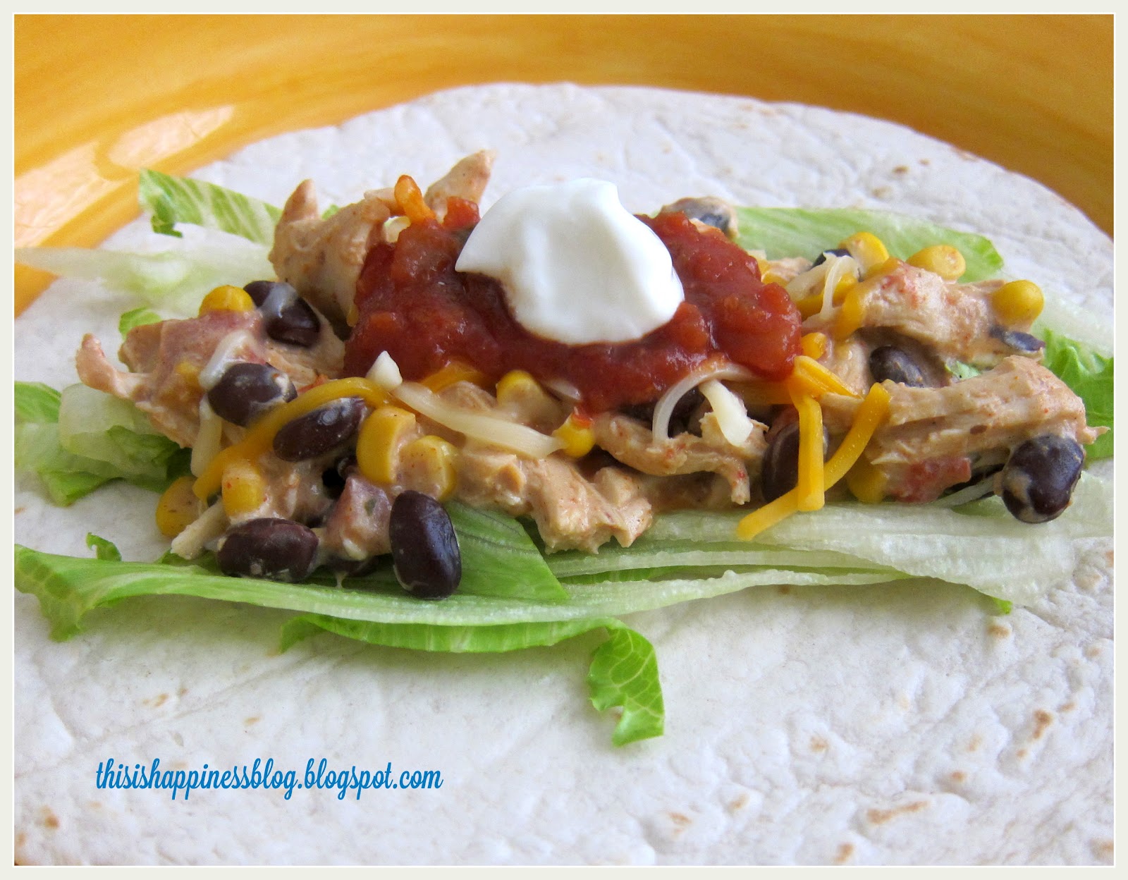this is happiness cream cheese crockpot burritos